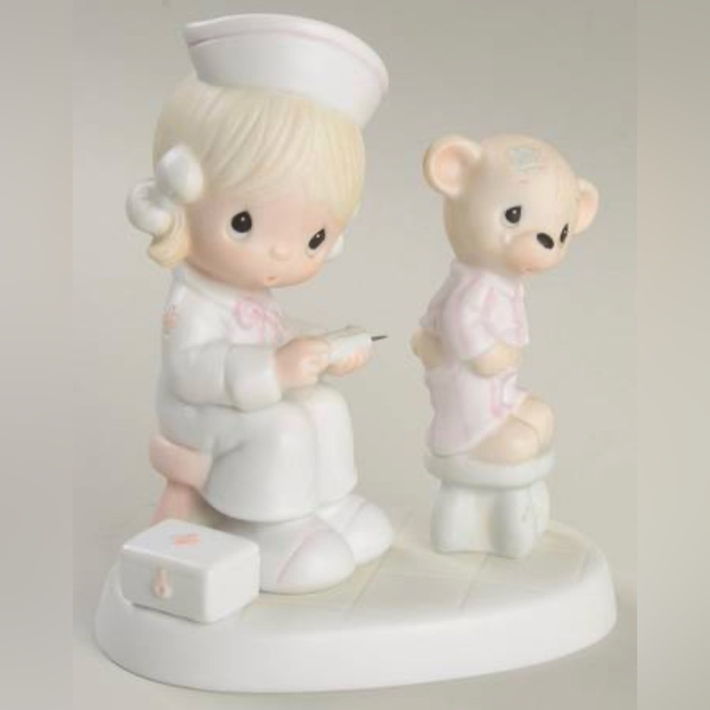 Enesco Precious Moments “Love Bears All Things”Nurse and Bear Figurine 1981